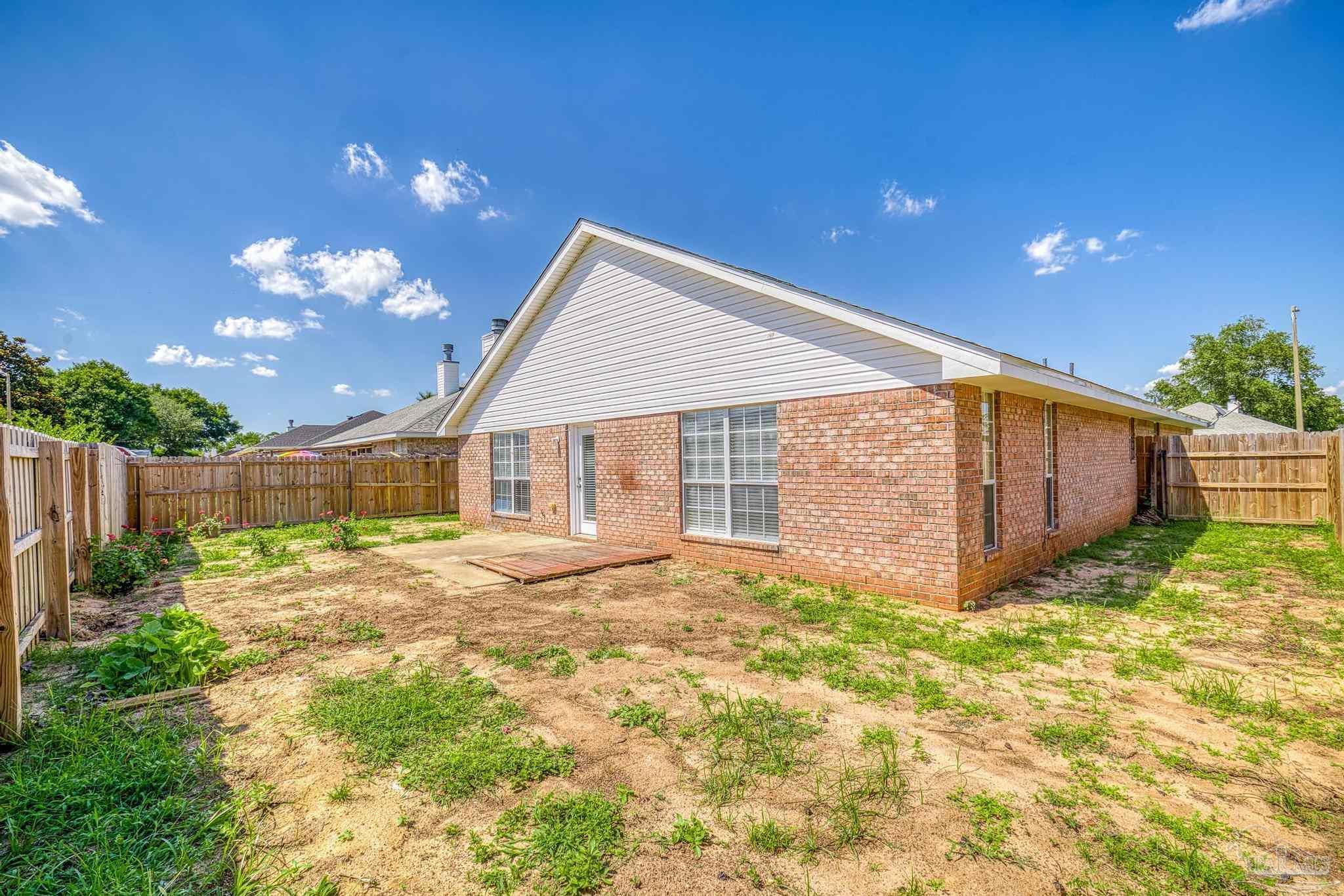 4769 Ribault Lane Milton, FL 32570 - Photo 31 of 34 a view of a backyard of the house