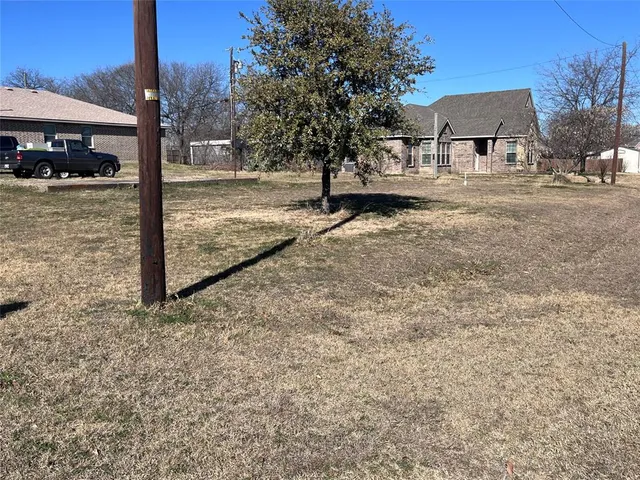 a view of a yard and front view of a house