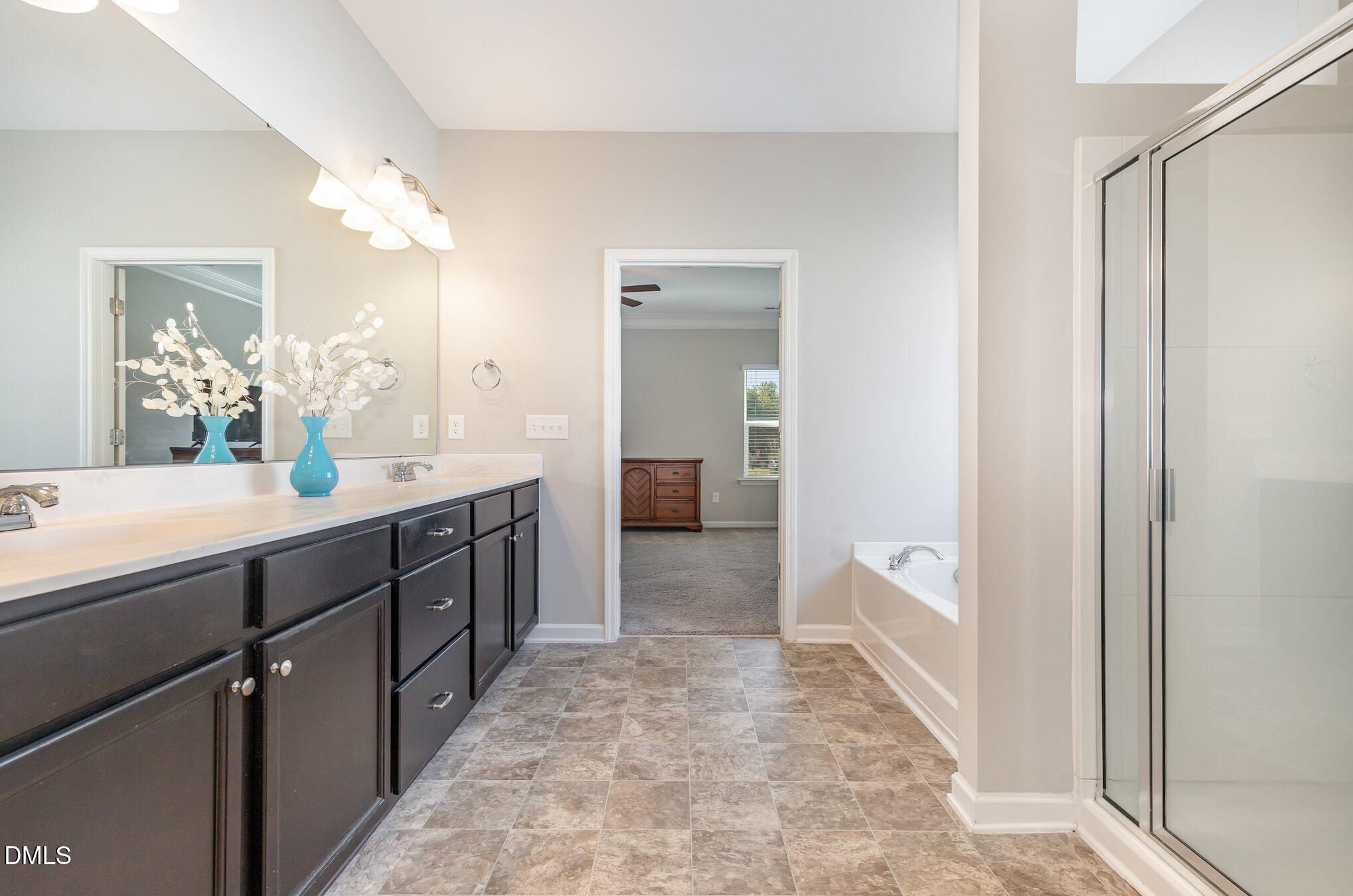 187 Highland Rhodes Drive Clayton, NC 27520 - Photo 13 of 23 a bathroom with a sink and a mirror