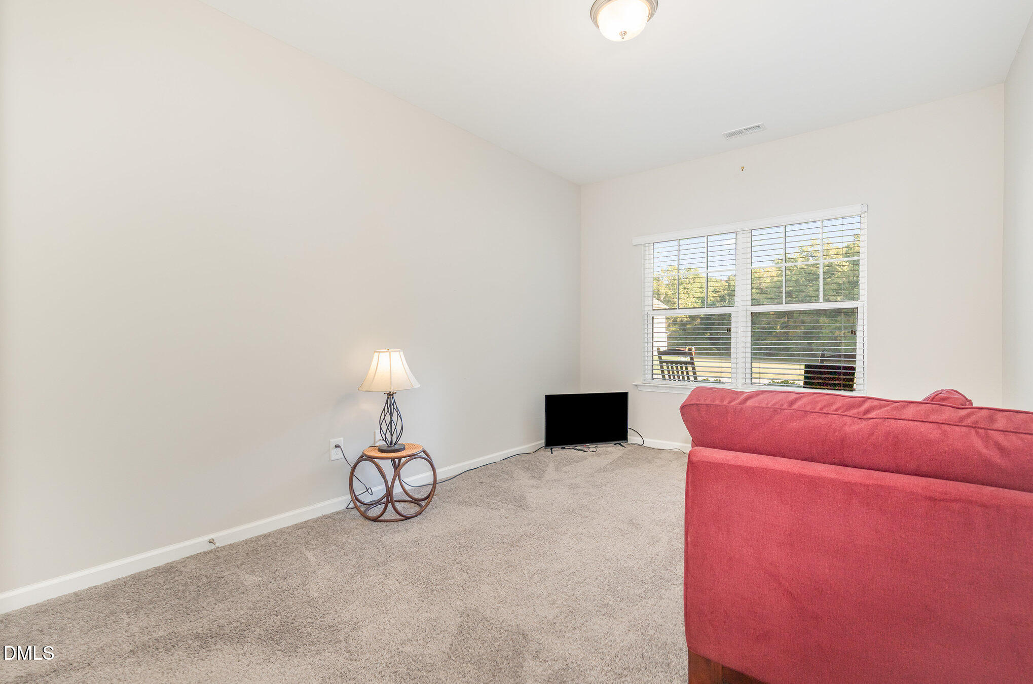 187 Highland Rhodes Drive Clayton, NC 27520 - Photo 15 of 23 a house view with a seating space