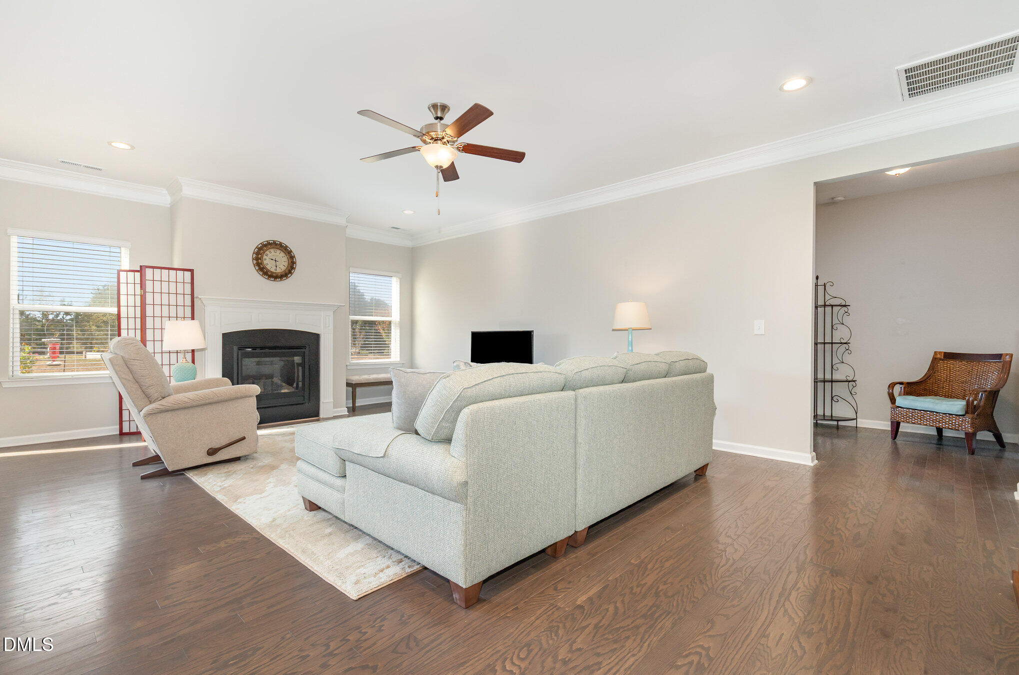 187 Highland Rhodes Drive Clayton, NC 27520 - Photo 5 of 23 a living room with furniture and a fireplace