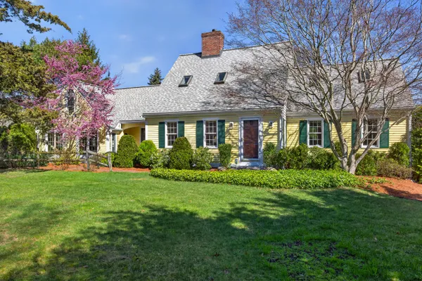 a front view of a house with a yard
