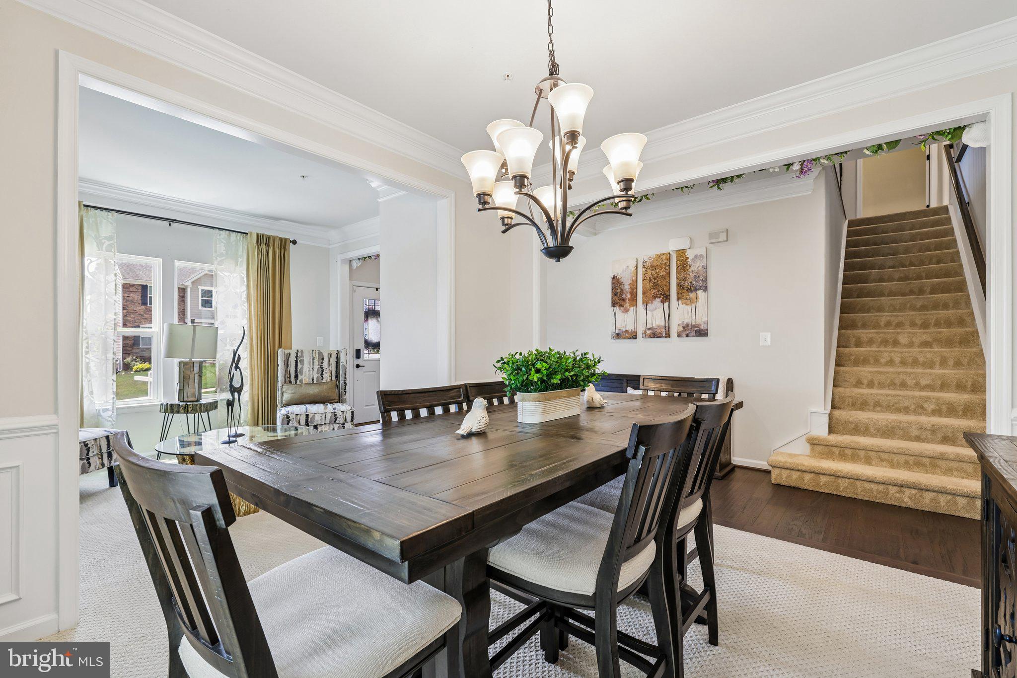 507 Potomac Road Joppa, MD 21085 - Photo 23 of 66 a view of a dining room with furniture wooden floor and chandelier
