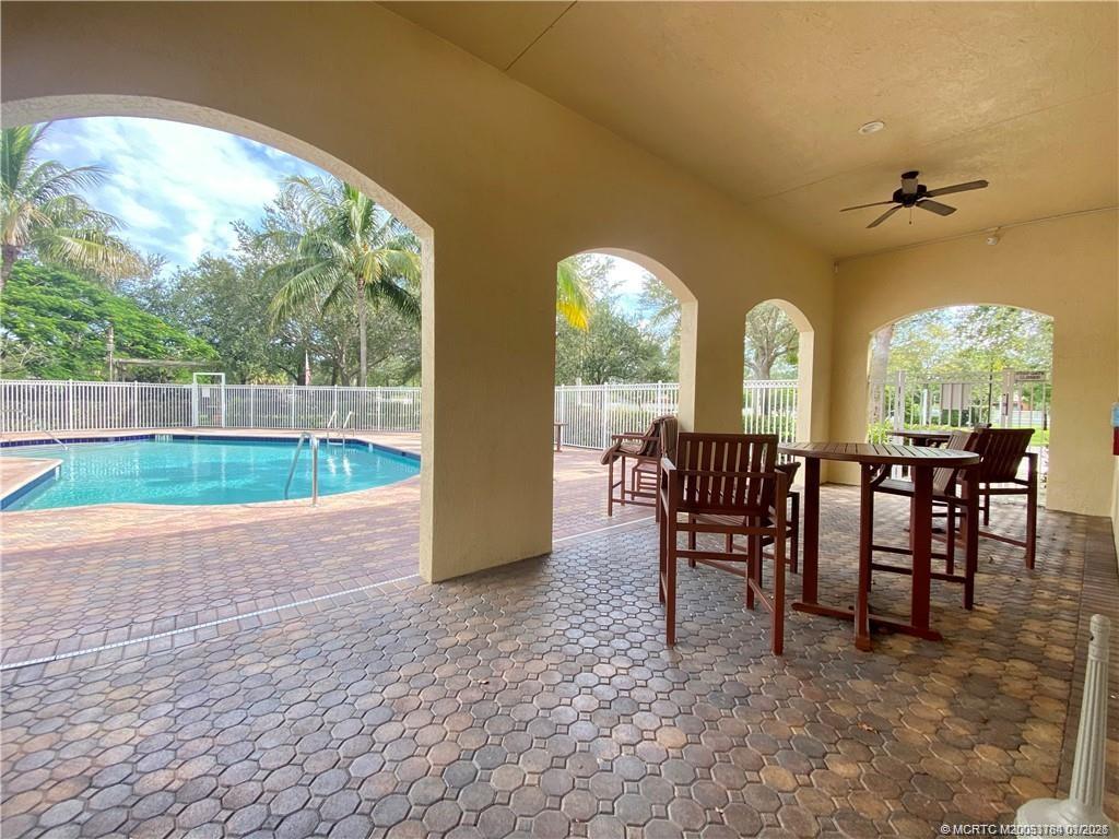 59 Southeast Palermo, Unit 102 Stuart, FL 34994 - Photo 18 of 18 a view of a dining room with furniture and chandelier