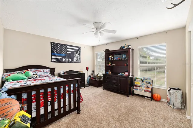 a bedroom with furniture and a window