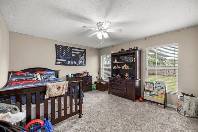 a bedroom with furniture and a window