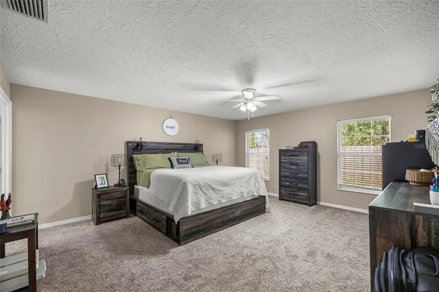 a bedroom with a bed and a desk