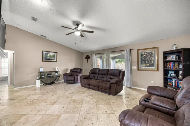 a living room with furniture and a couch