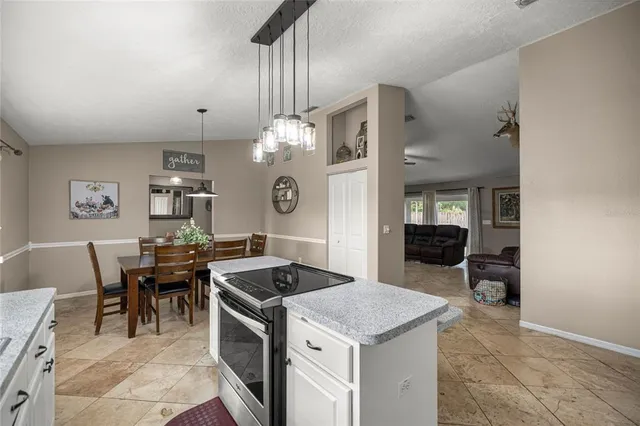 a kitchen that has a table and chairs in it