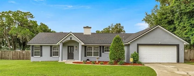front view of a house with a yard