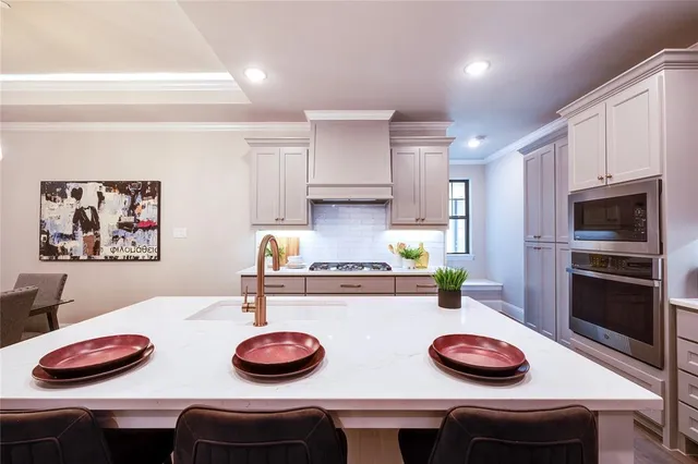 a kitchen with appliances and cabinets