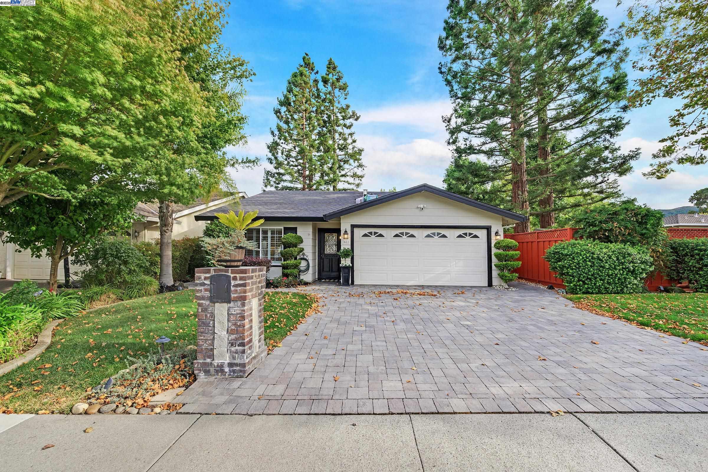 61 Ayamonte Court San Ramon, CA 94583 - Photo 1 of 1 a front view of a house with a yard and garage