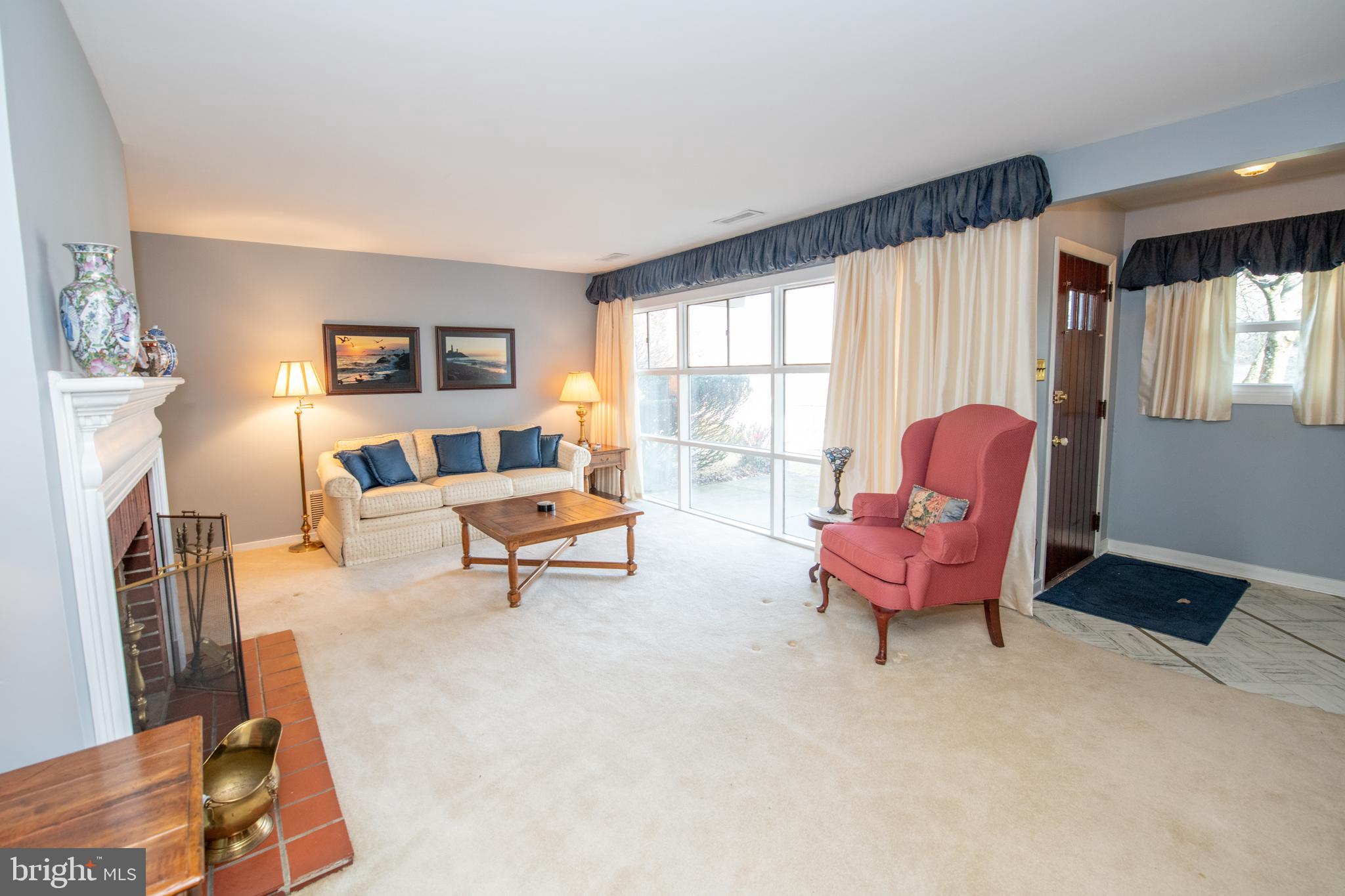 8810 Tyson Road Glenside, PA 19038 - Photo 11 of 53 a living room with furniture and a large window