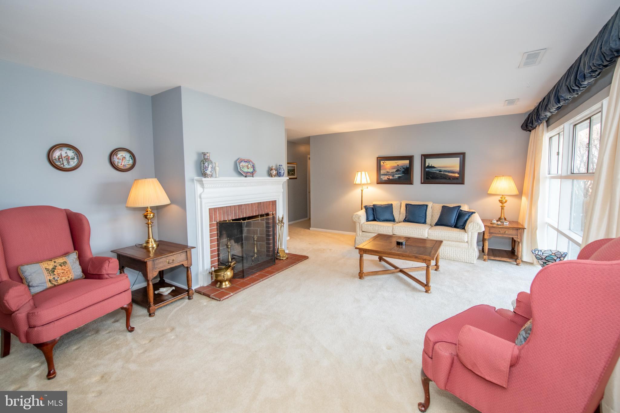 8810 Tyson Road Glenside, PA 19038 - Photo 12 of 53 a living room with furniture and a fireplace