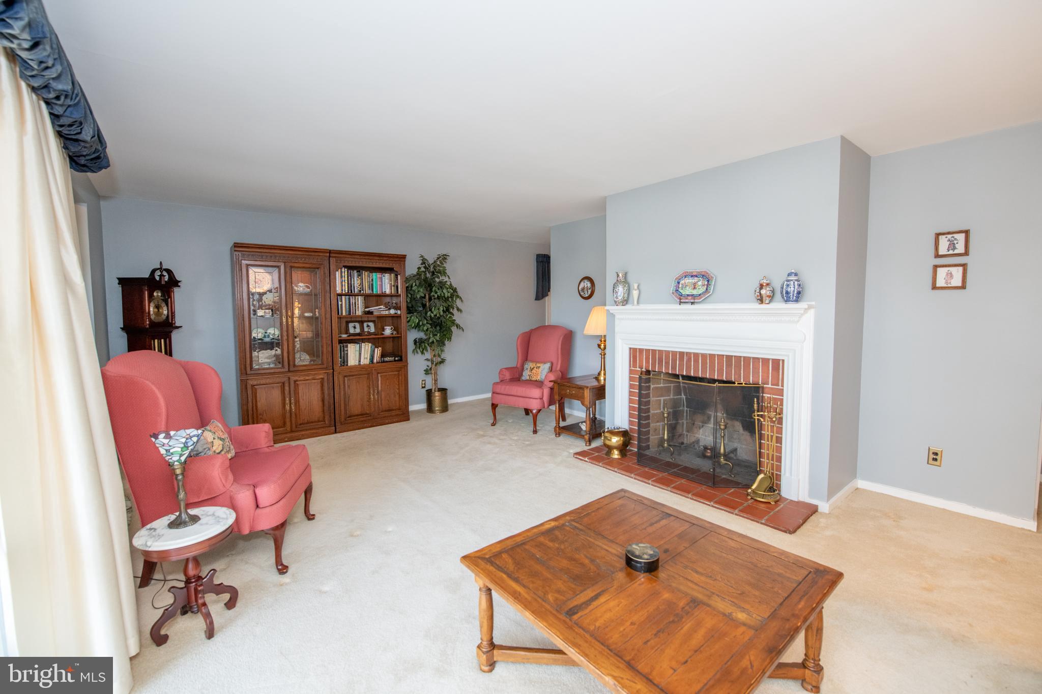 8810 Tyson Road Glenside, PA 19038 - Photo 15 of 53 a living room with furniture and a fireplace