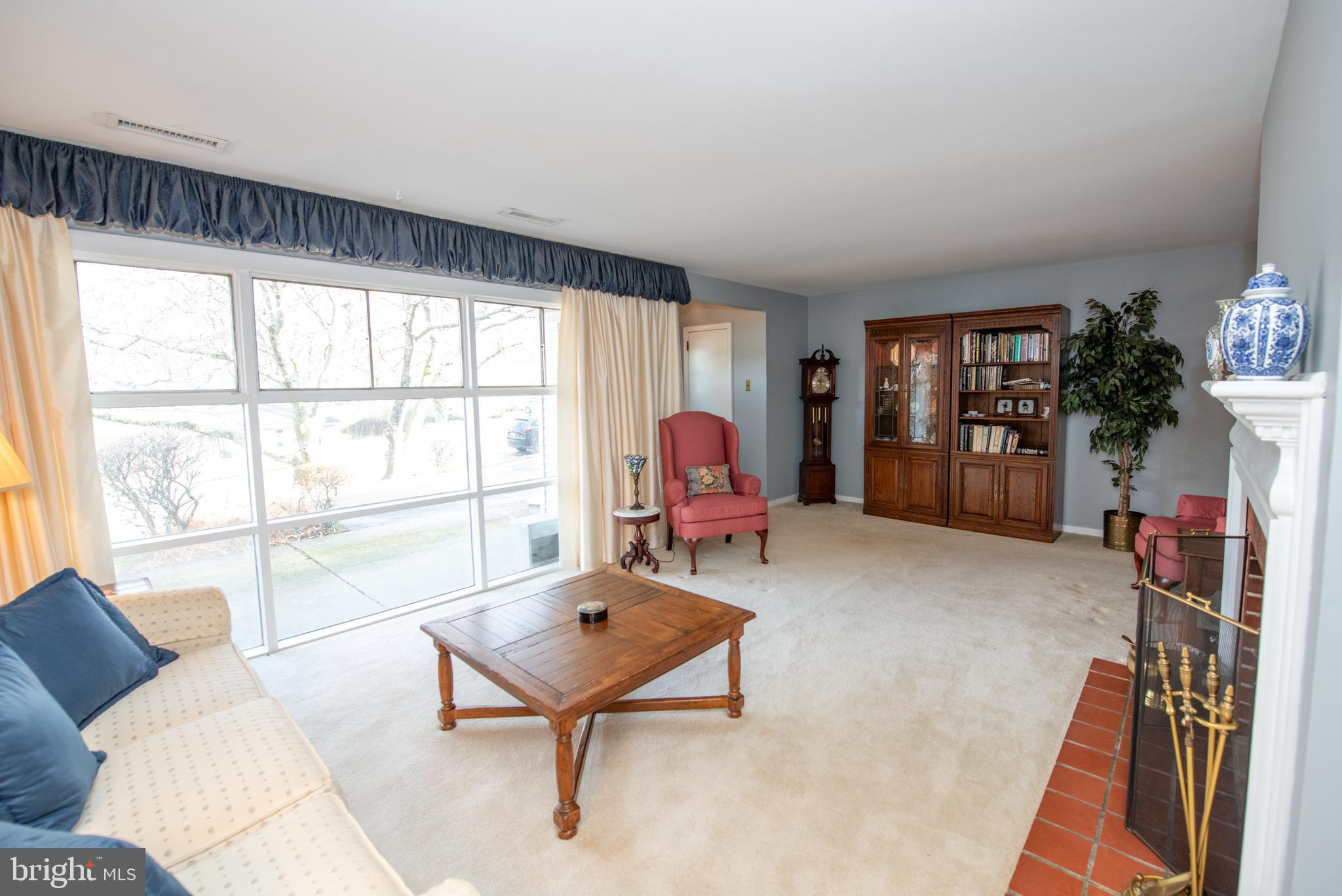 8810 Tyson Road Glenside, PA 19038 - Photo 16 of 53 a living room with furniture and a window