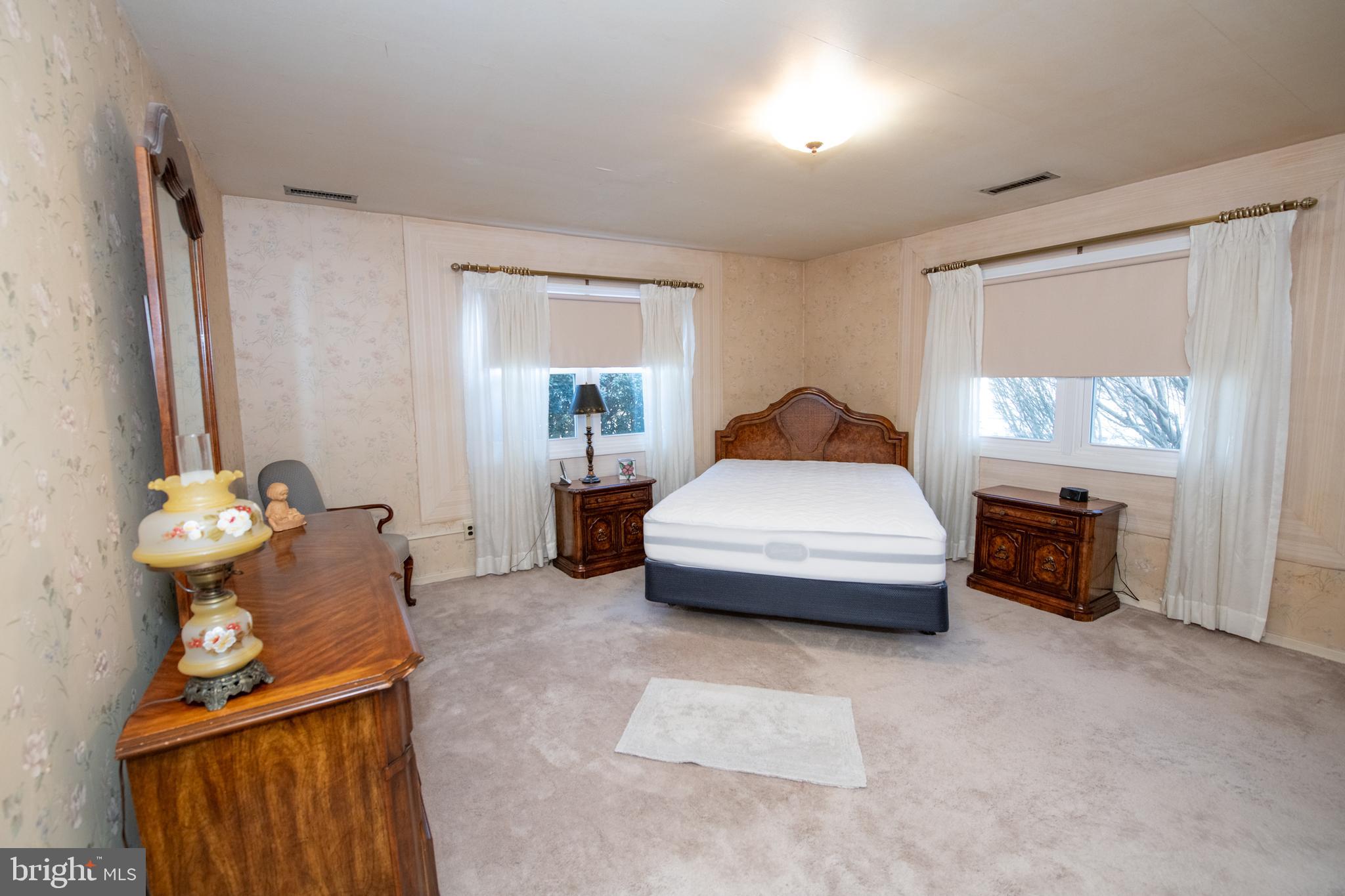 8810 Tyson Road Glenside, PA 19038 - Photo 17 of 53 a bedroom with bed and window