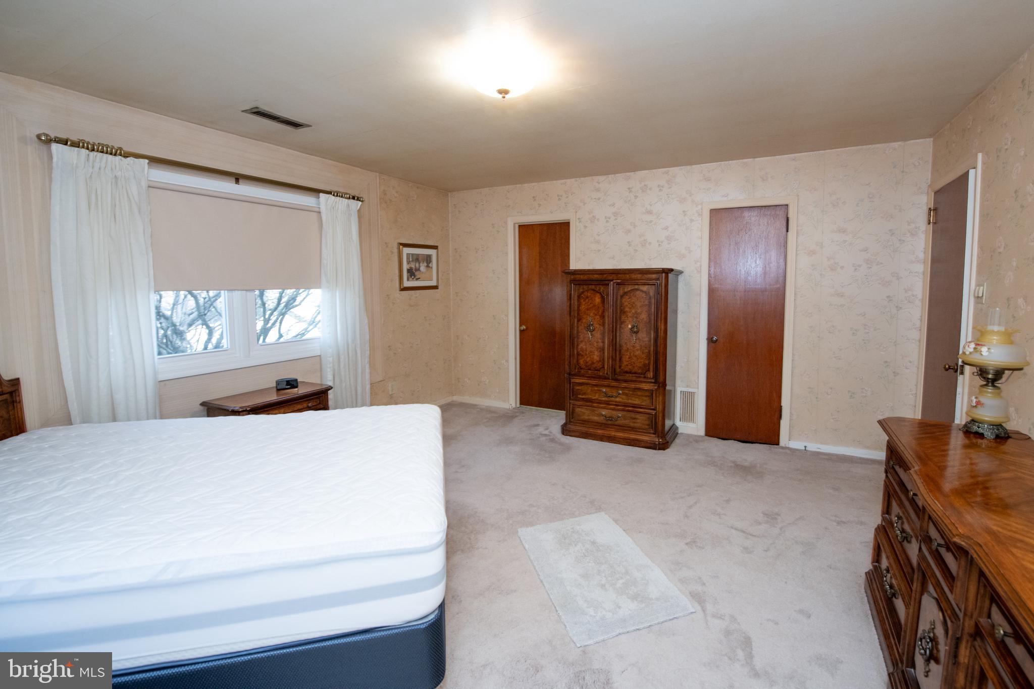 8810 Tyson Road Glenside, PA 19038 - Photo 19 of 53 a bedroom with a bed and a dresser