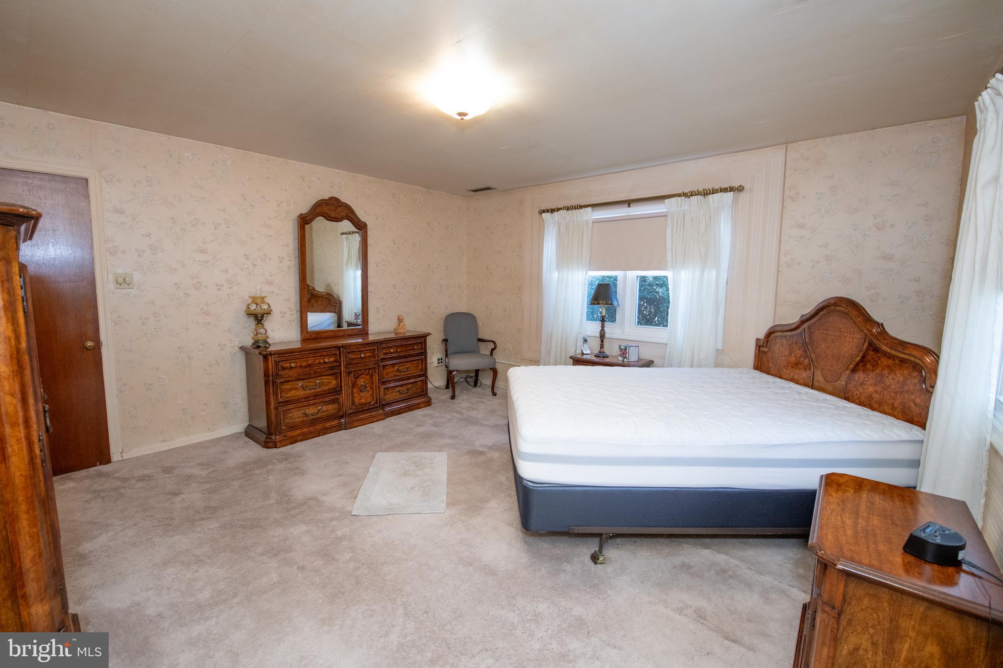 8810 Tyson Road Glenside, PA 19038 - Photo 20 of 53 a bedroom with a bed and a window