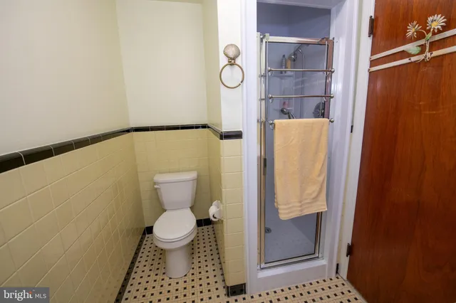 a bathroom with a sink a toilet and window