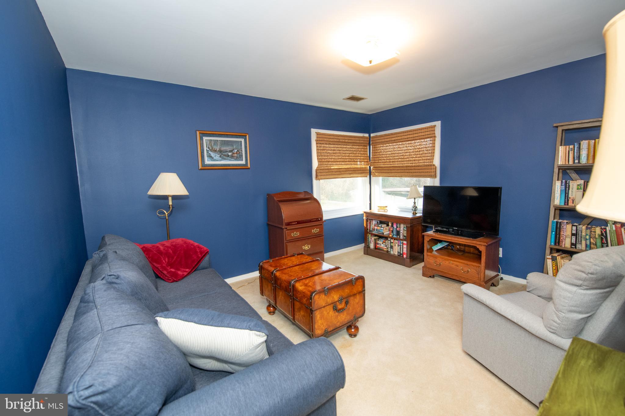 8810 Tyson Road Glenside, PA 19038 - Photo 25 of 53 a living room with furniture and a flat screen tv
