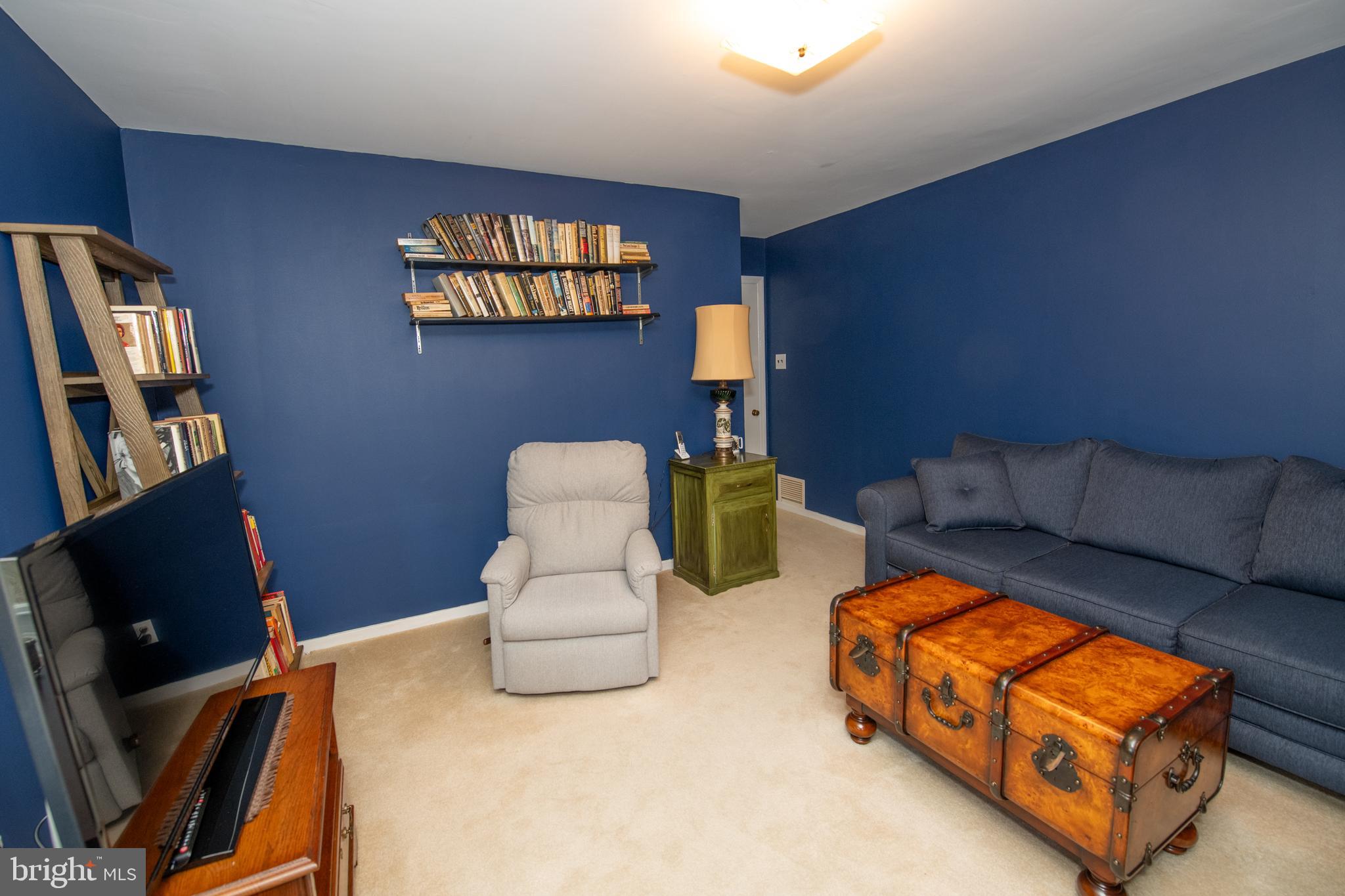 8810 Tyson Road Glenside, PA 19038 - Photo 27 of 53 a living room with furniture and a flat screen tv