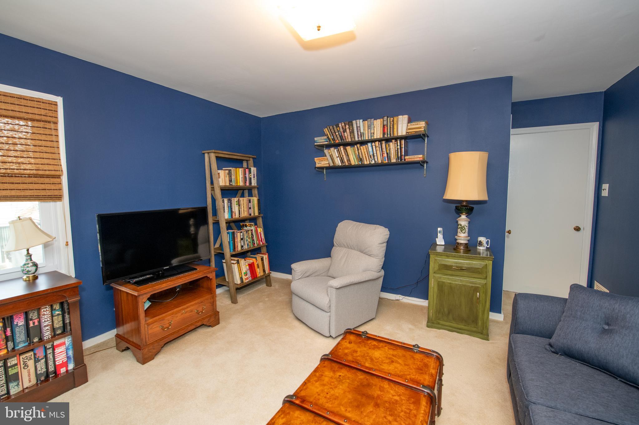 8810 Tyson Road Glenside, PA 19038 - Photo 29 of 53 a living room with furniture and a flat screen tv