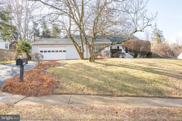 a view of a street with a building in the background