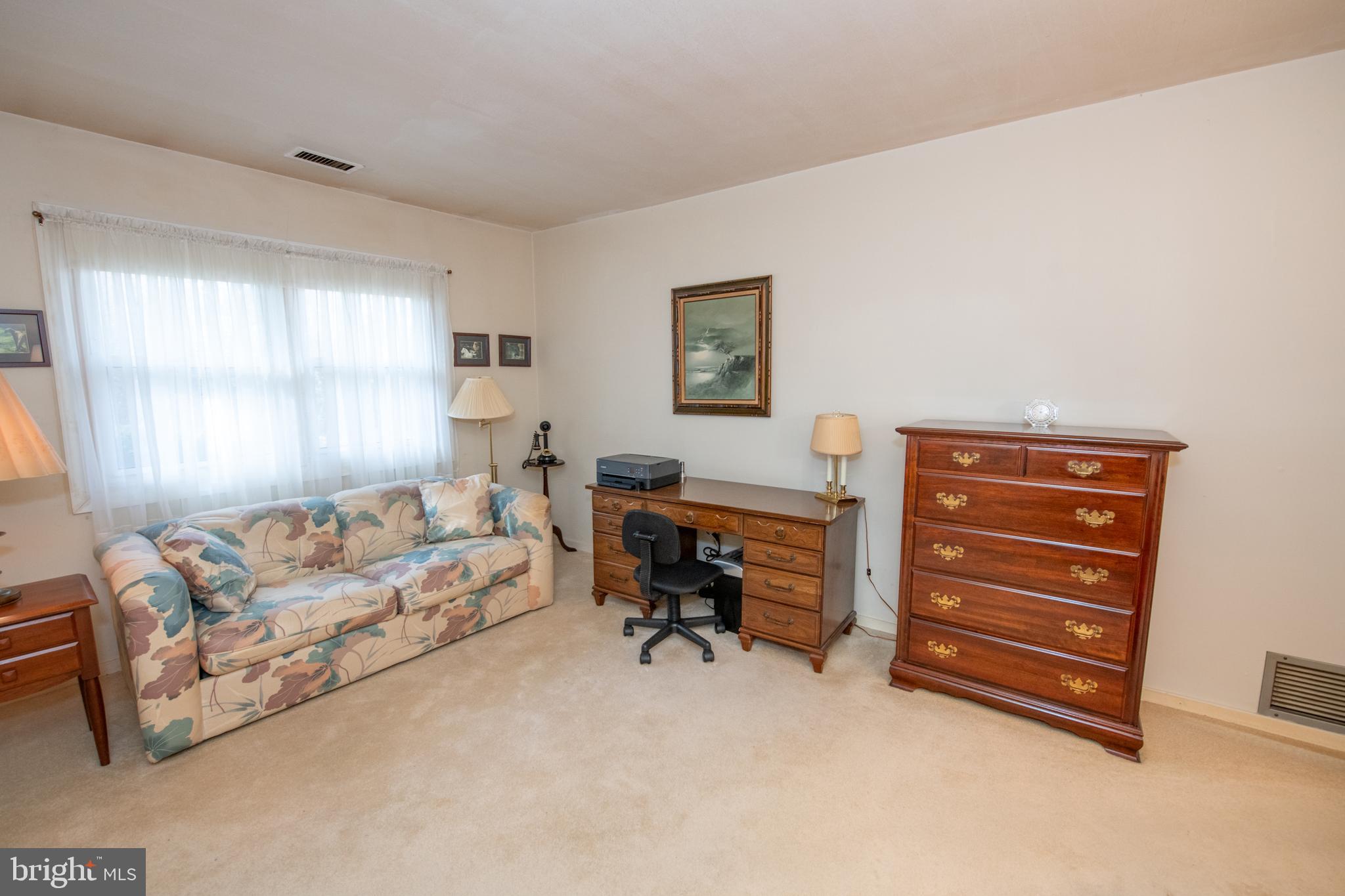 8810 Tyson Road Glenside, PA 19038 - Photo 32 of 53 a living room with furniture and a window