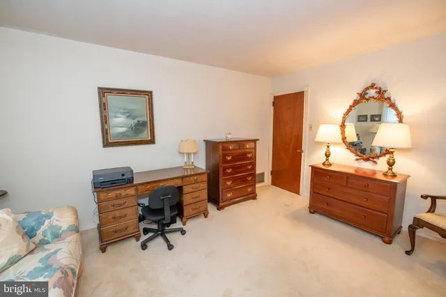 a bed room with a bed and a lamp