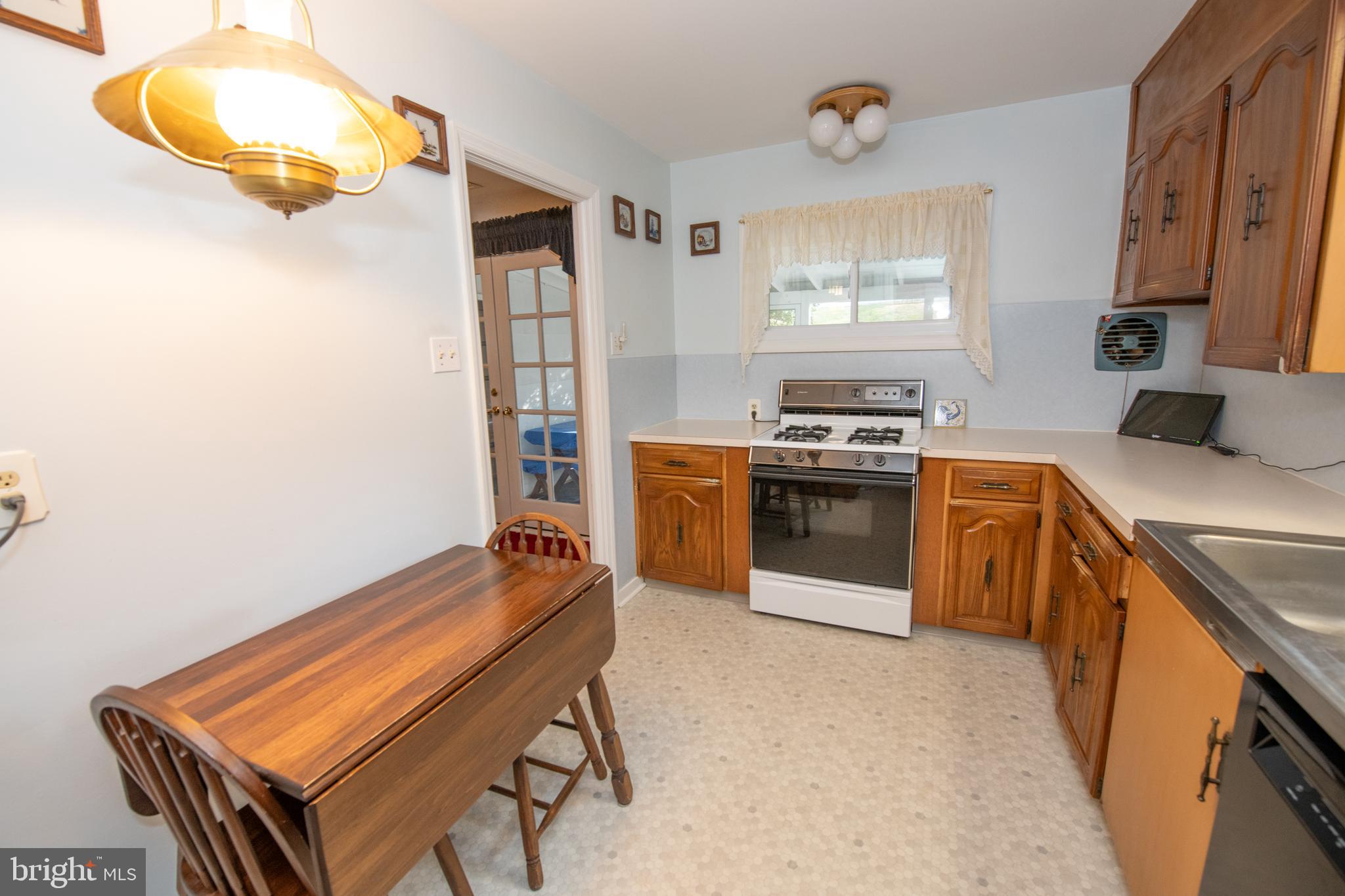 8810 Tyson Road Glenside, PA 19038 - Photo 41 of 53 a kitchen with a stove and a microwave