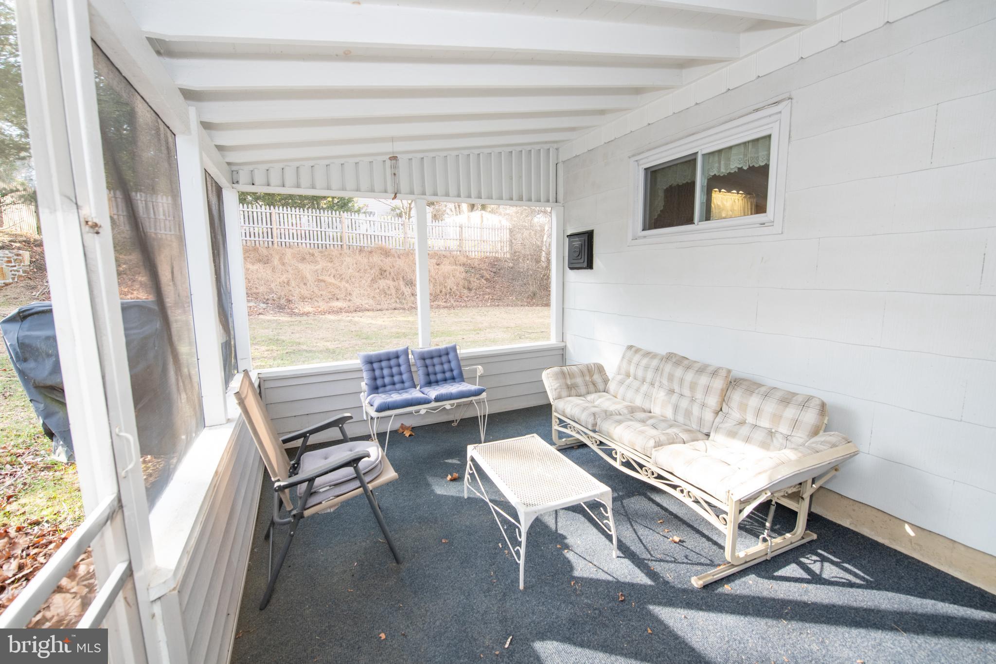8810 Tyson Road Glenside, PA 19038 - Photo 48 of 53 a living room with furniture and a window