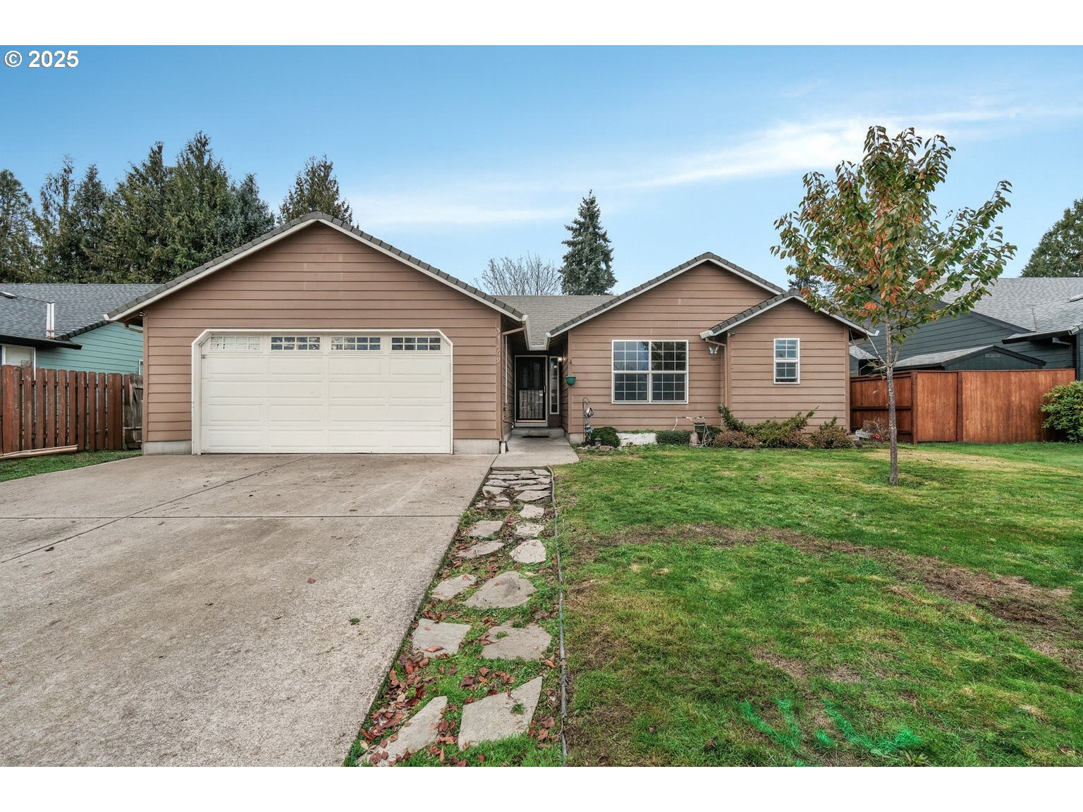 52269 Southeast Tyler Street Scappoose, OR 97056 - Photo 1 of 21 a view of an house with backyard space and garden