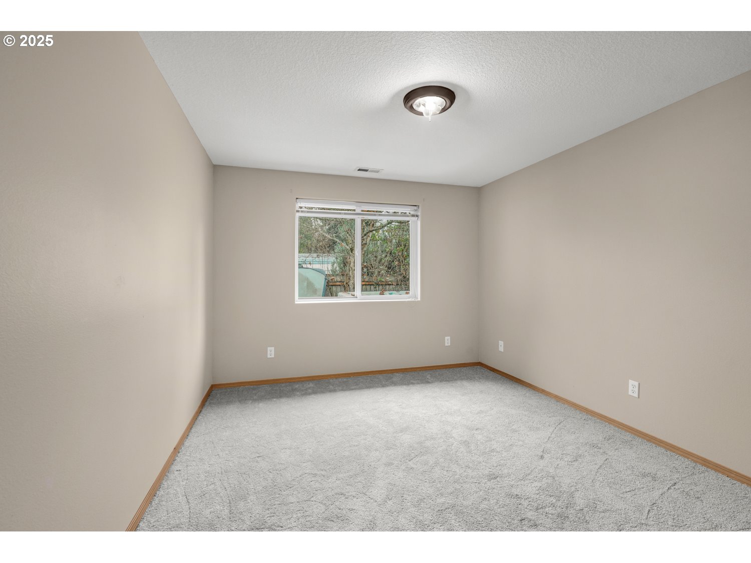 52269 Southeast Tyler Street Scappoose, OR 97056 - Photo 17 of 21 a view of an empty room with a window