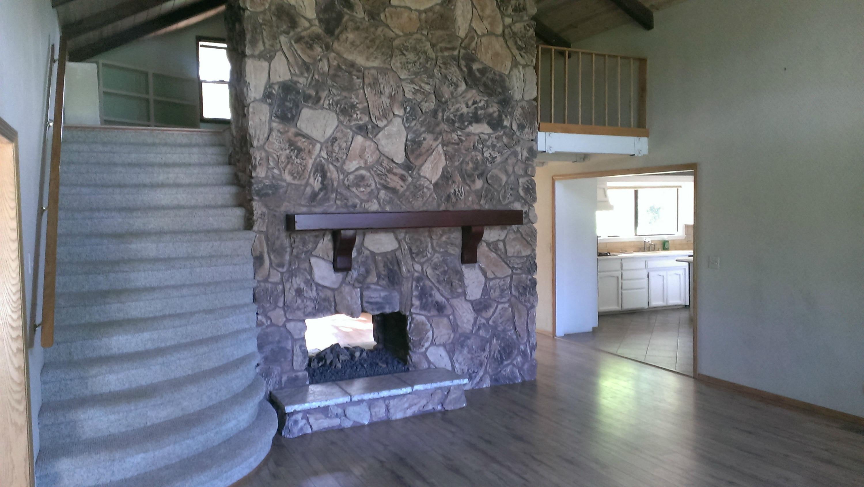 6266 Riverside Drive Redding, CA 96001 - Photo 7 of 14 Stairs/fireplace