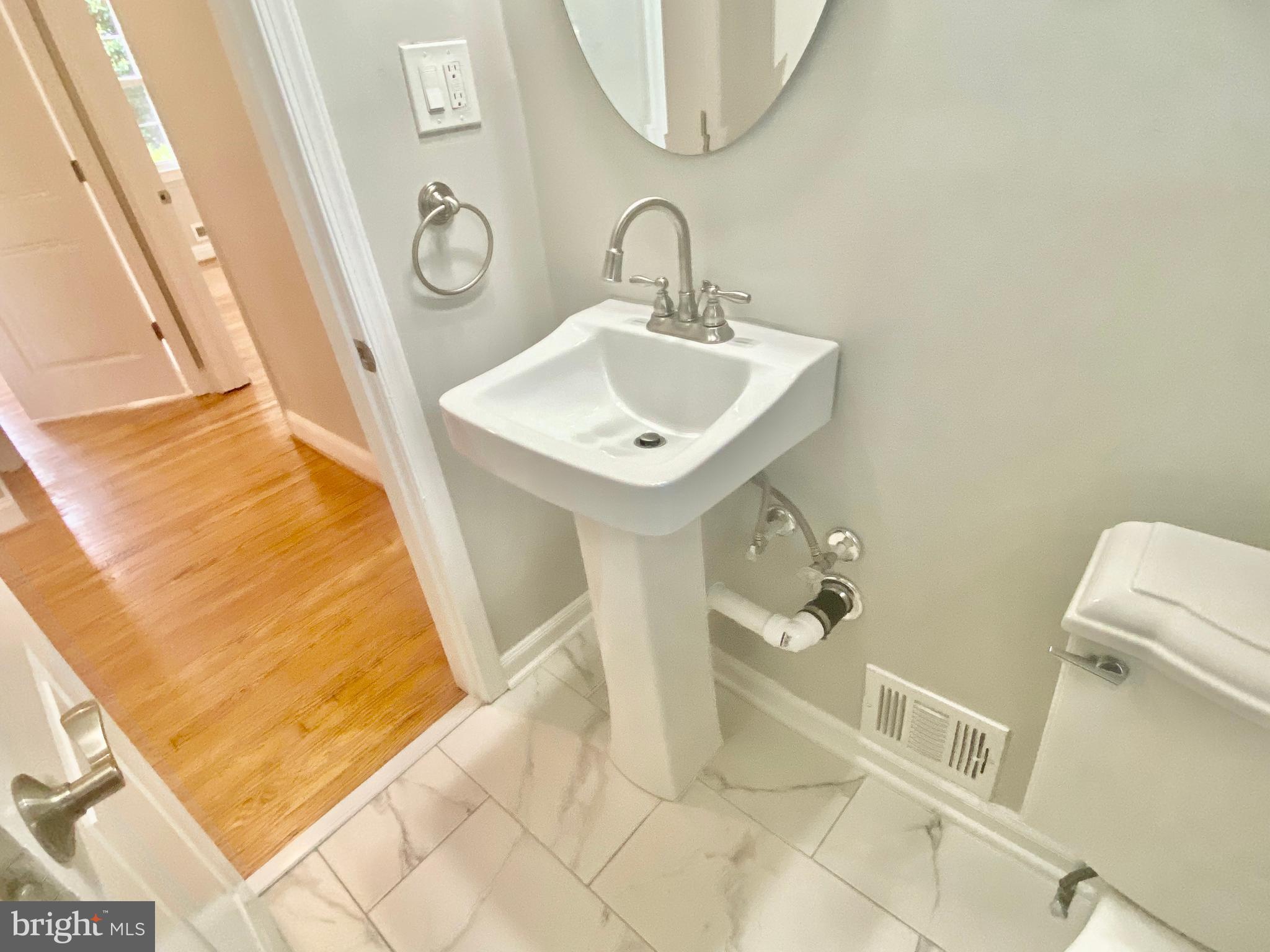 10007 Portland Road Silver Spring, MD 20901 - Photo 20 of 41 NEW HALLWAY FULL BATHROOM