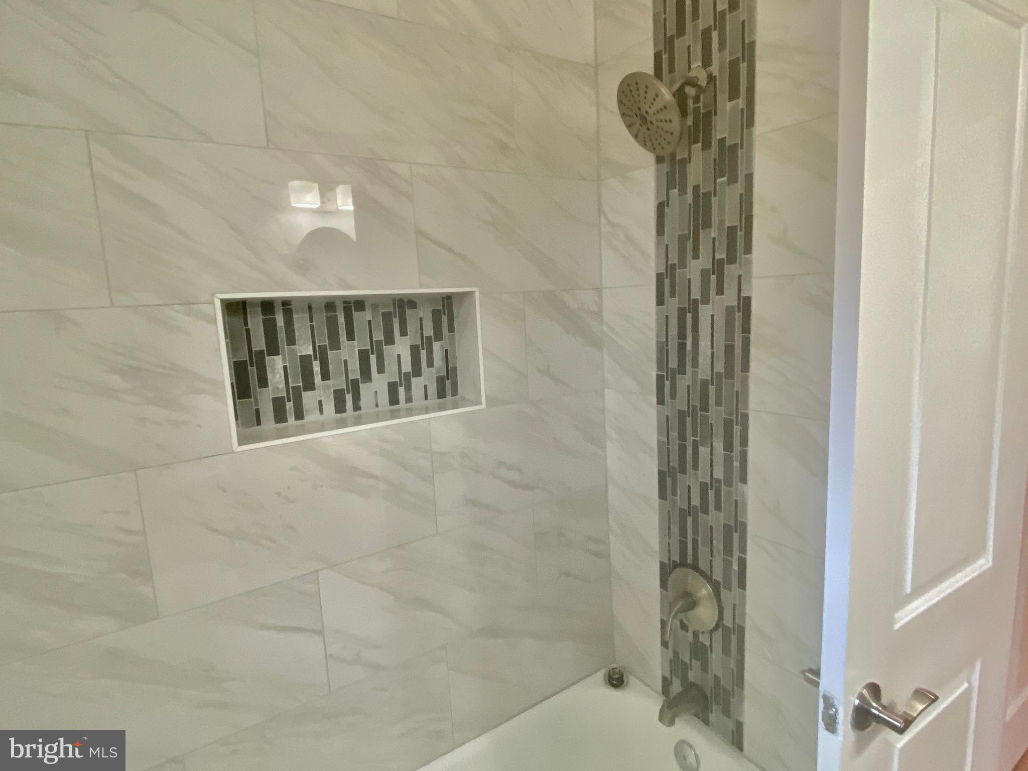 10007 Portland Road Silver Spring, MD 20901 - Photo 21 of 41 HALLWAYFULL BATHROOM