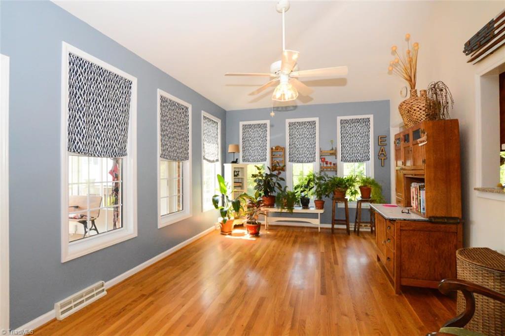 1141 Winding Ridge Road Walnut Cove, NC 27052 - Photo 12 of 30 Comfy den or sunroom off of kitchen and living room is great for plants, and full of windows.