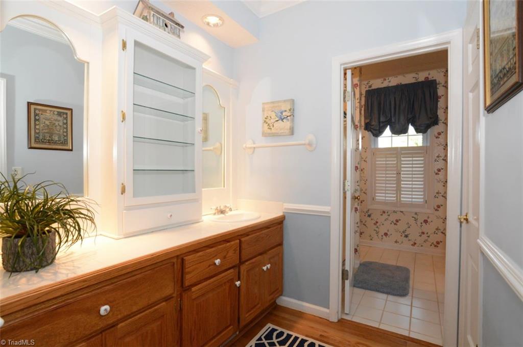 1141 Winding Ridge Road Walnut Cove, NC 27052 - Photo 14 of 30 Downstairs master bath offers double vanities, and lots of storage.