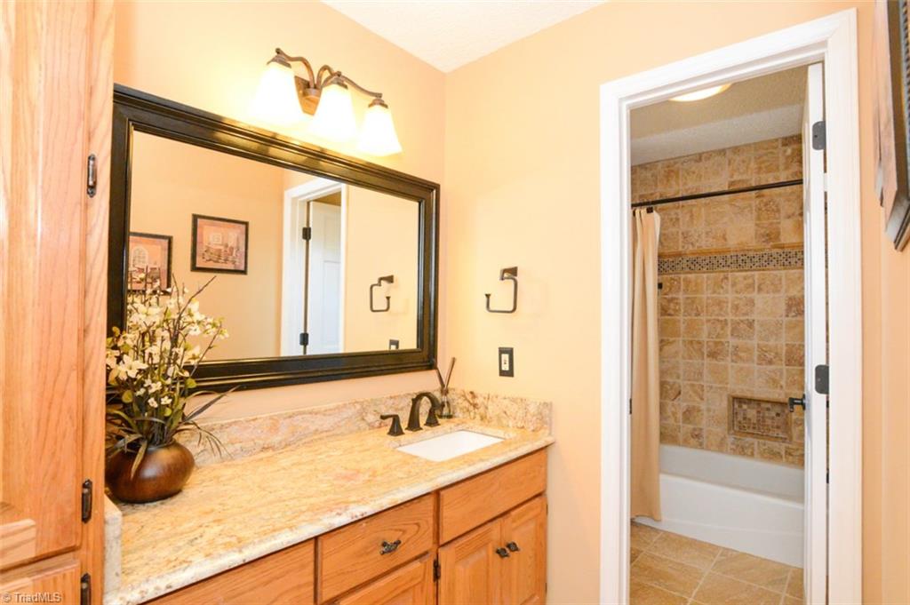 1141 Winding Ridge Road Walnut Cove, NC 27052 - Photo 20 of 30 Tastefully updated bathroom 3 offers great tile and countertops, with a beautiful sink.