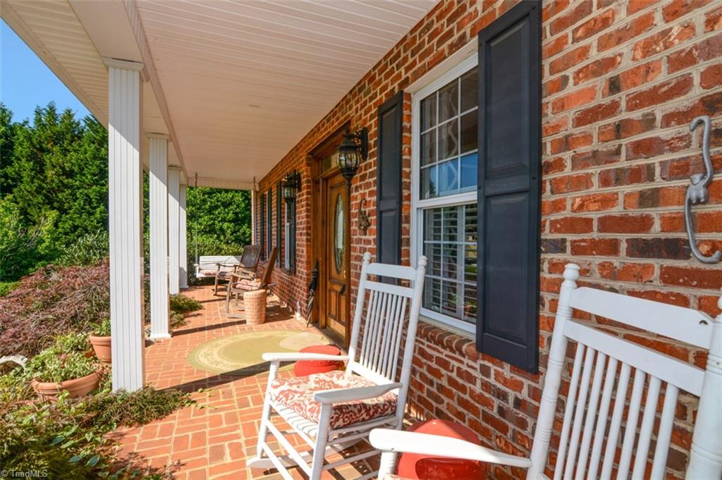 1141 Winding Ridge Road Walnut Cove, NC 27052 - Photo 3 of 30 Welcoming rocking chair front porch.
