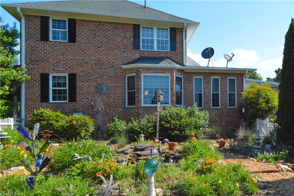 1141 Winding Ridge Road Walnut Cove, NC 27052 - Photo 22 of 30 Overview of the side courtyard/gardens---also a great view when inside the breakfast room area.