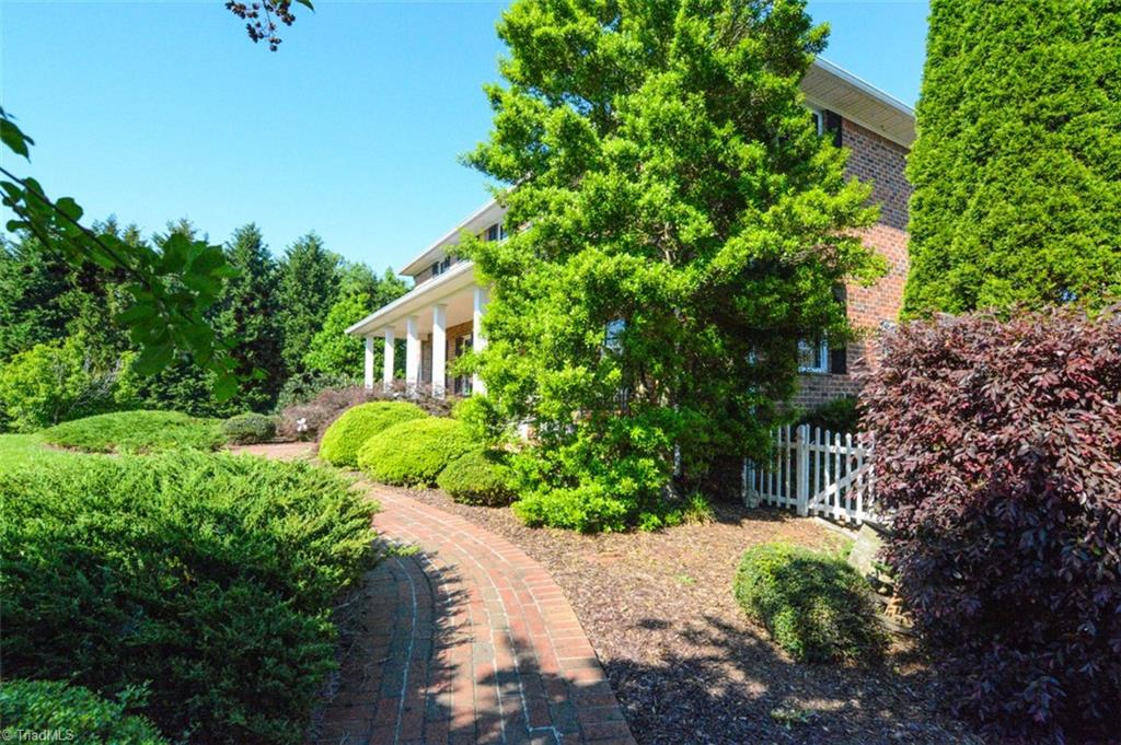 1141 Winding Ridge Road Walnut Cove, NC 27052 - Photo 23 of 30 Gorgeous landscaping and lush greenery flank the entrance as you drive to the parking areas.