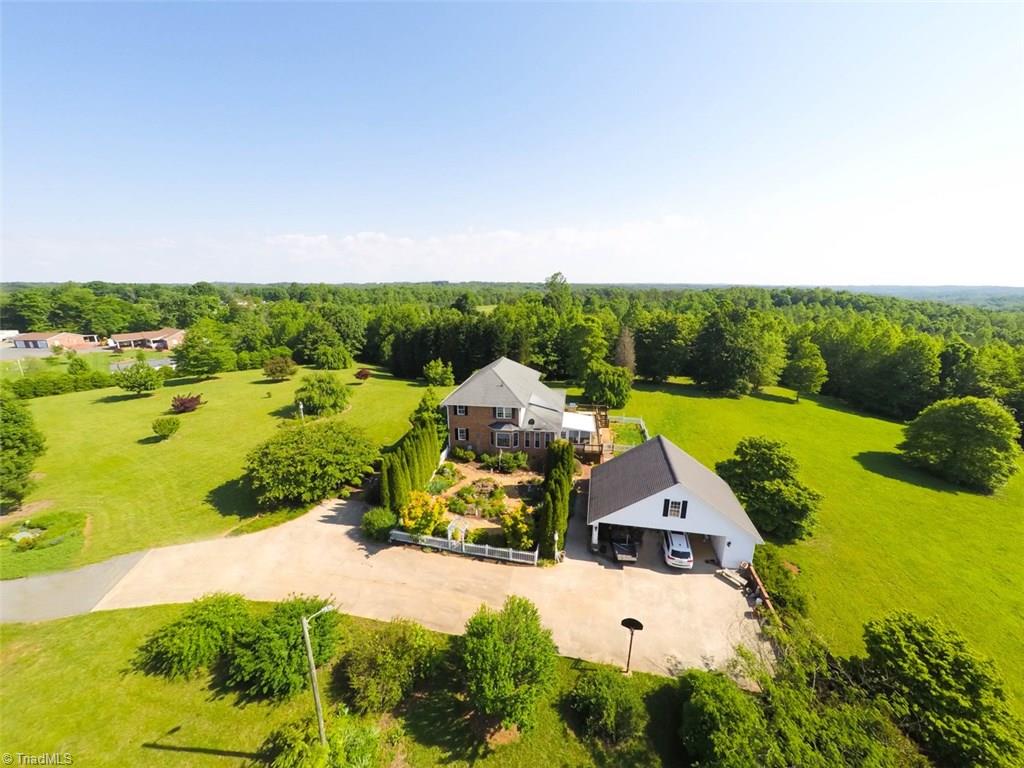 1141 Winding Ridge Road Walnut Cove, NC 27052 - Photo 28 of 30 Side view of this lovely estate and shows size of courtyard, and carport with bonus storage galore.