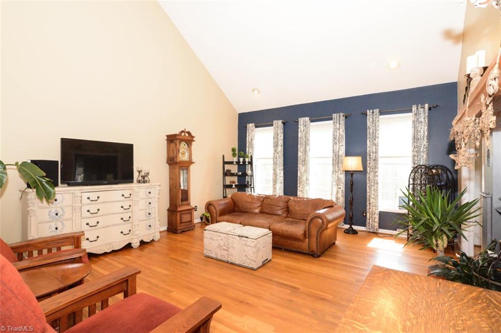 1141 Winding Ridge Road Walnut Cove, NC 27052 - Photo 6 of 30 Living room with vaulted ceilings and light filled windows.
