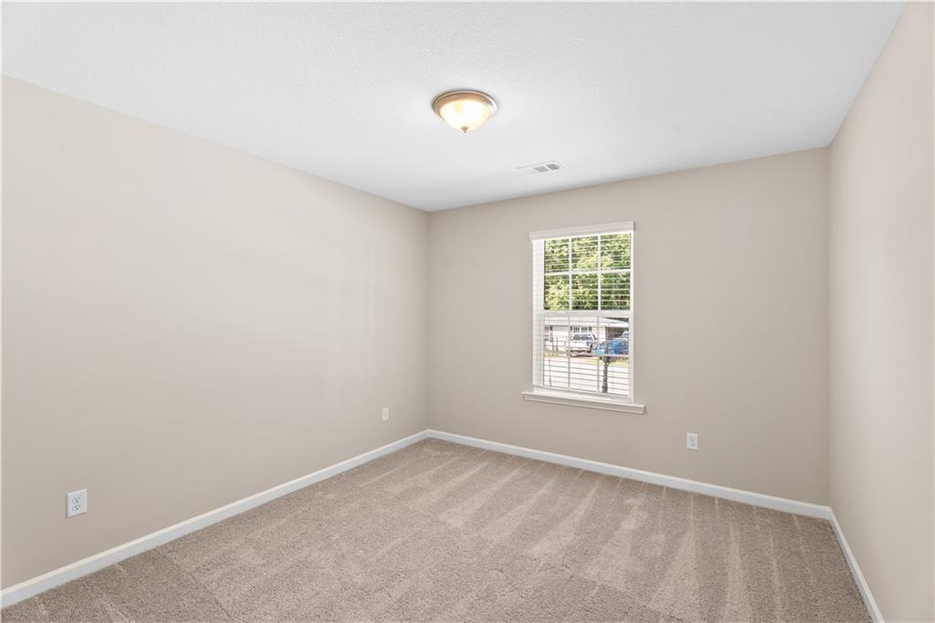 31 Whiterock Road Phenix City, AL 36869 - Photo 36 of 36 Carpeted spare room featuring baseboards