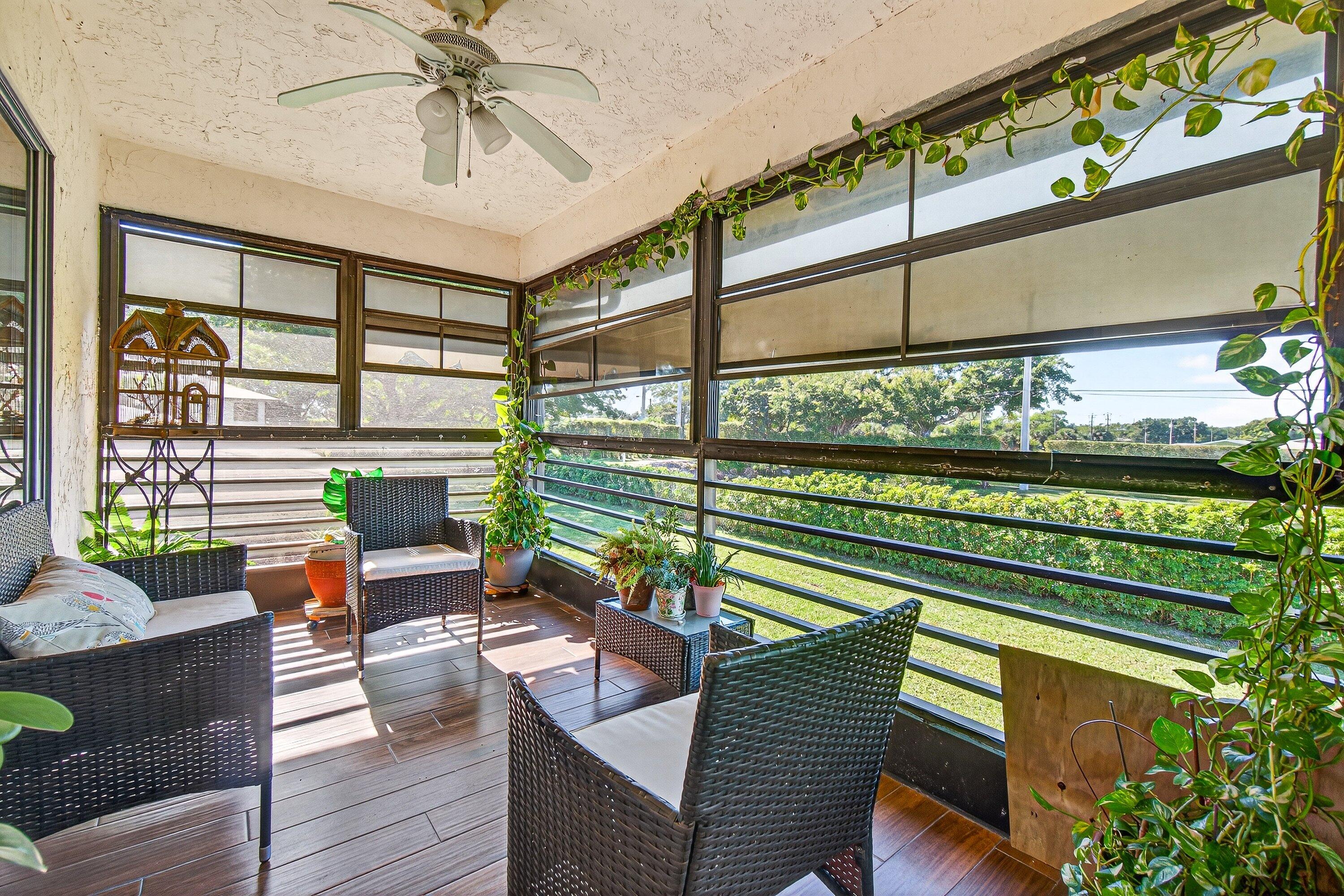 13465 Fishtail Palm Court, Unit D Delray Beach, FL 33484 - Photo 22 of 29 a outdoor living room with furniture