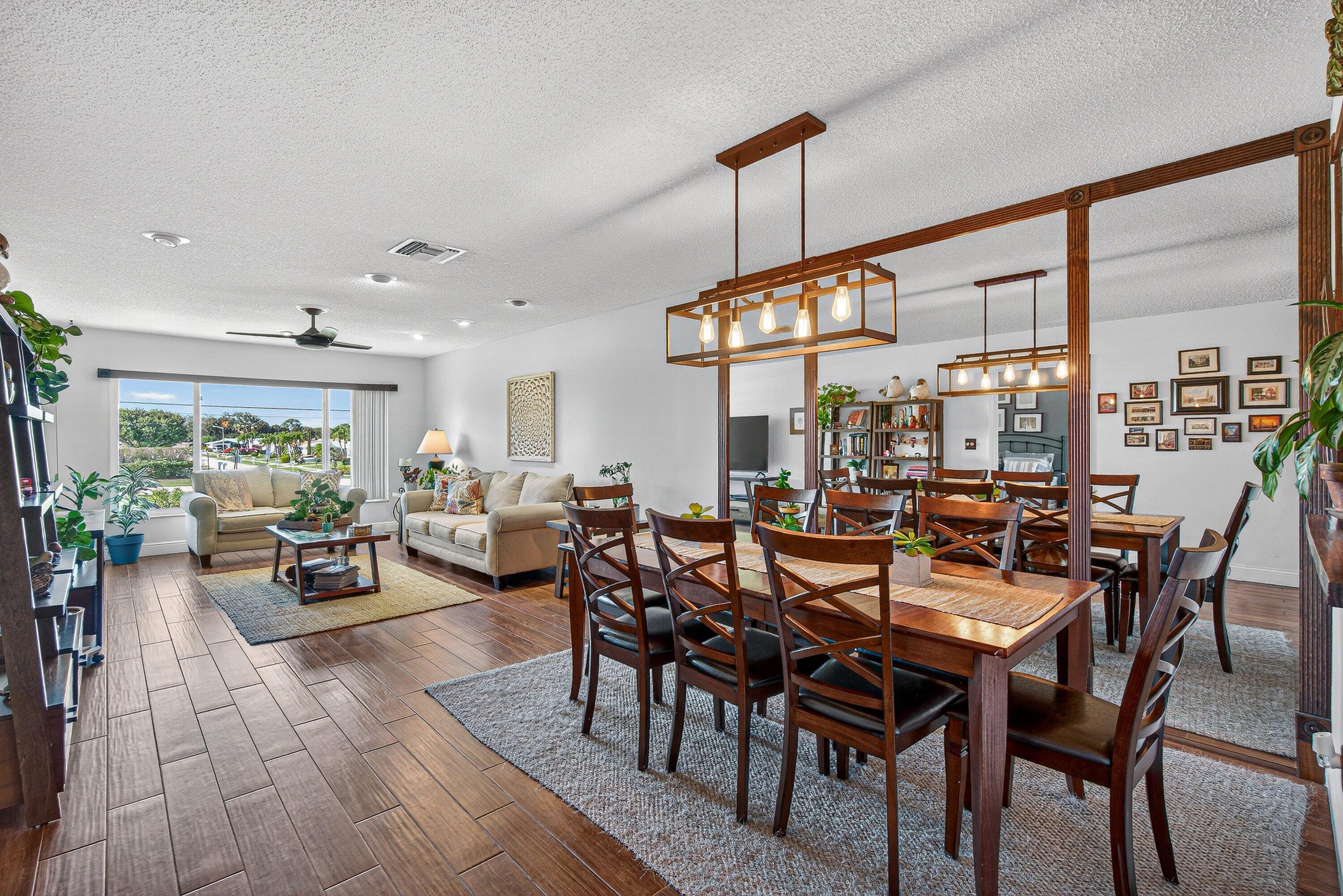 13465 Fishtail Palm Court, Unit D Delray Beach, FL 33484 - Photo 8 of 29 a view of a dining room with furniture window and outside view