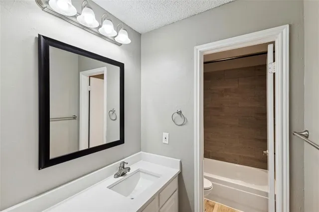 a bathroom with a sink a vanity and a mirror