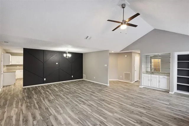 a view of livingroom with hardwood floor and a ceiling fan